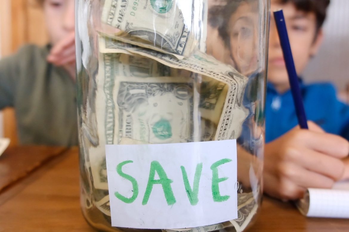 https://www.shutterstock.com/image-photo/children-placing-dollar-bills-into-labeled-2730895471?trackingId=4fa94ca7-39b4-40e5-9592-d94f37f6397e&listId=searchResults